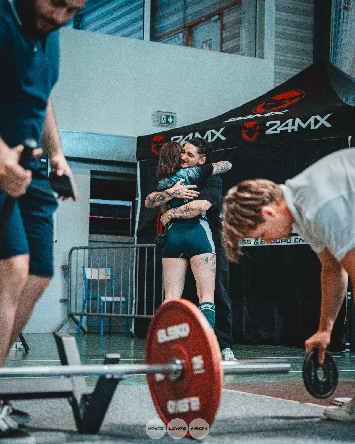 Hug between Atlas Coaching athletes
