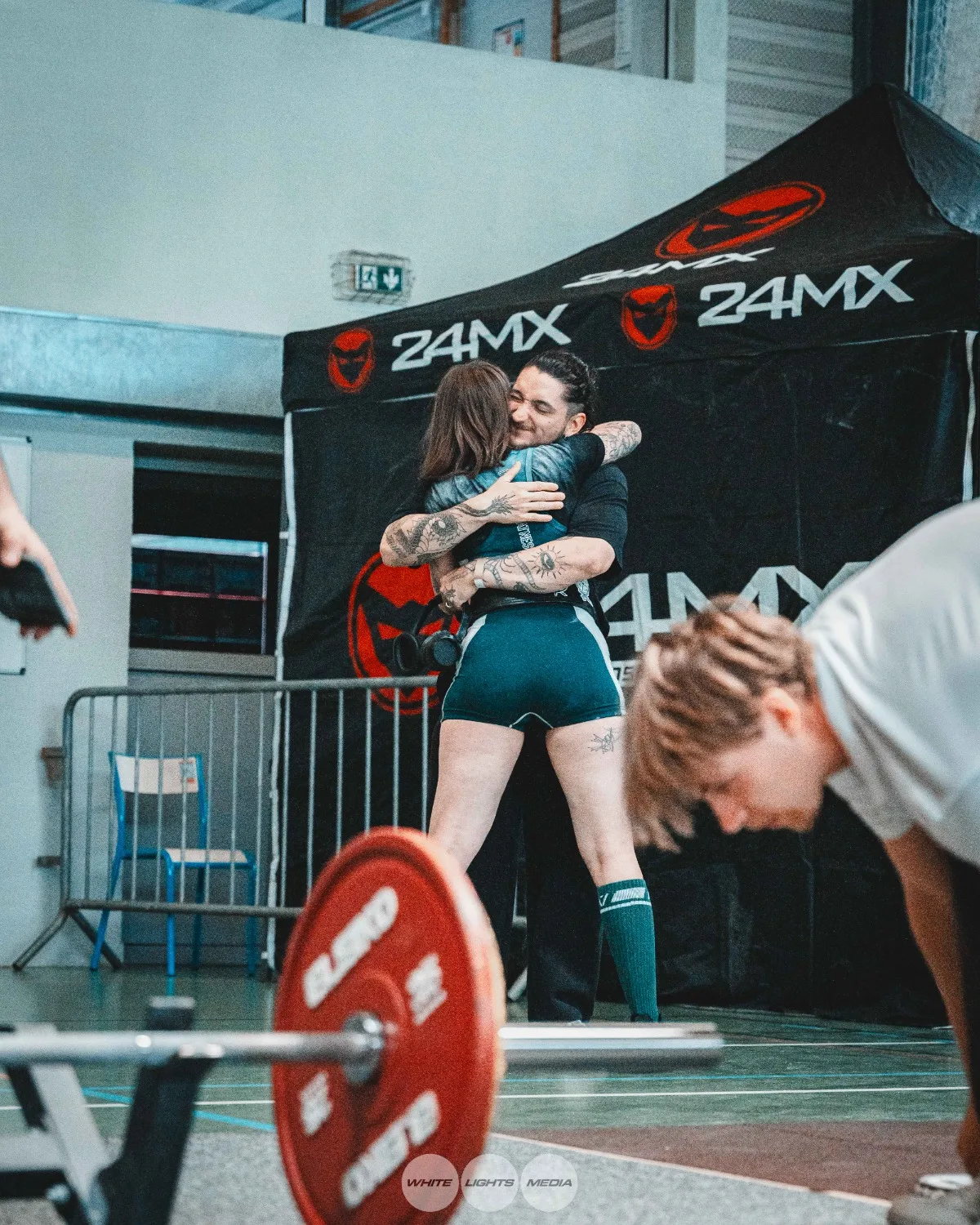 Hug between Atlas Coaching athletes