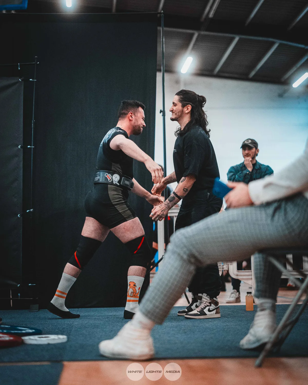Hug between Atlas Coaching athletes