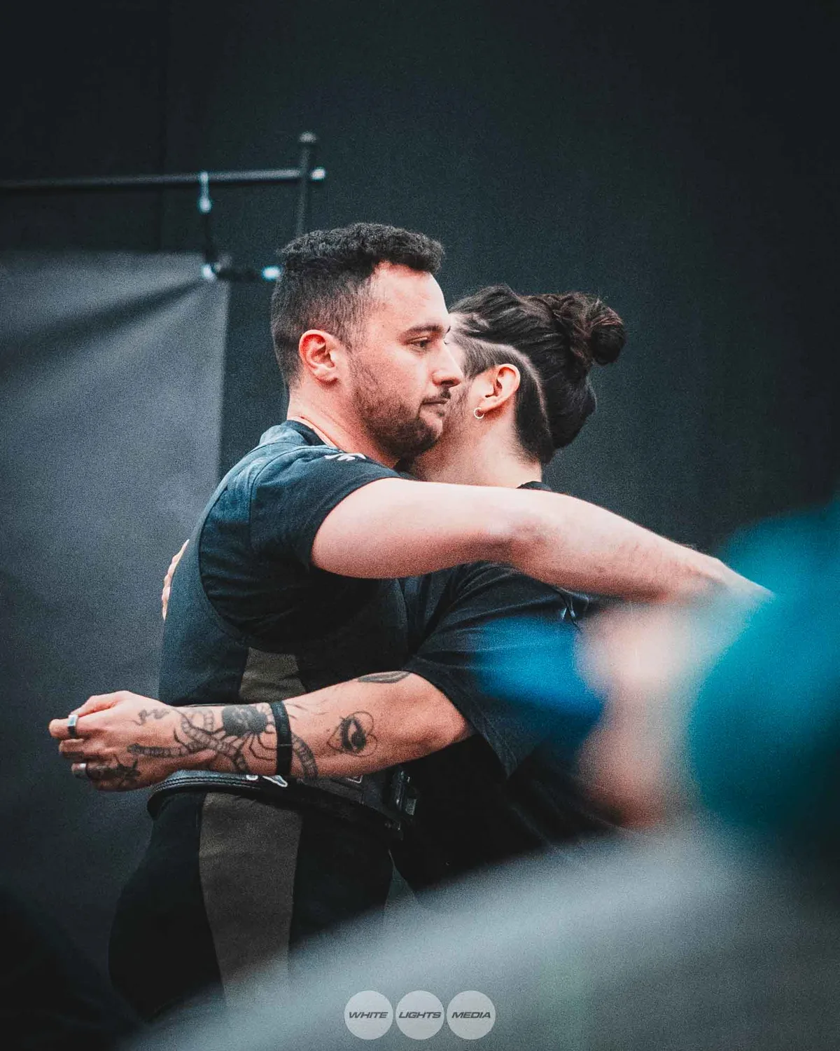 Hug between Atlas Coaching athletes