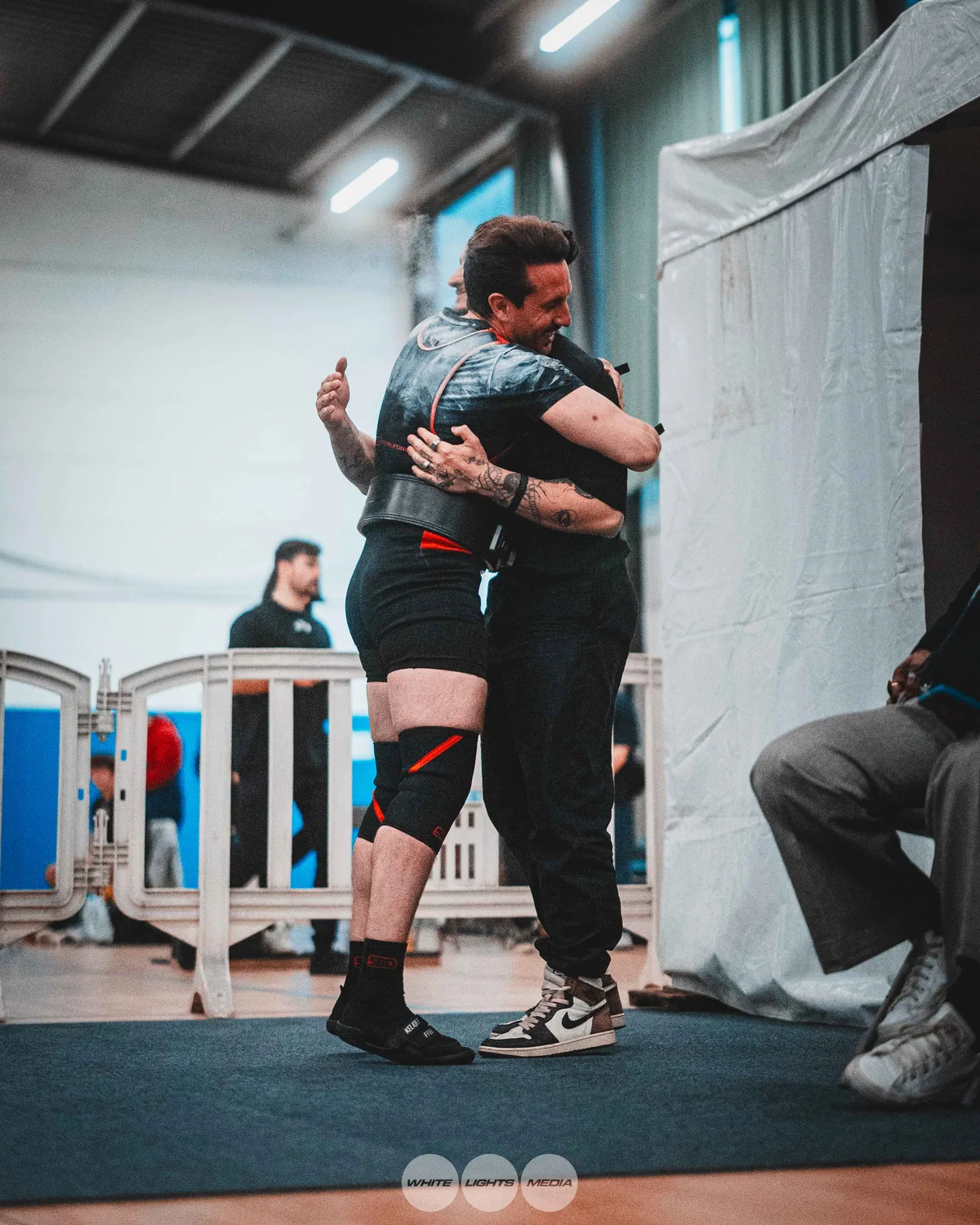 Hug between Atlas Coaching athletes