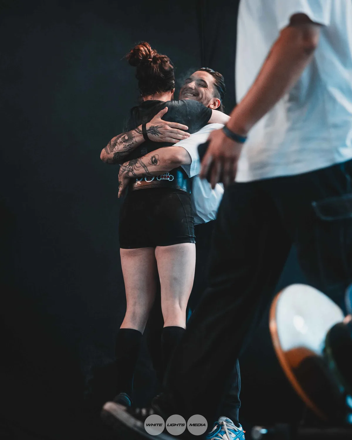 Hug between Atlas Coaching athletes