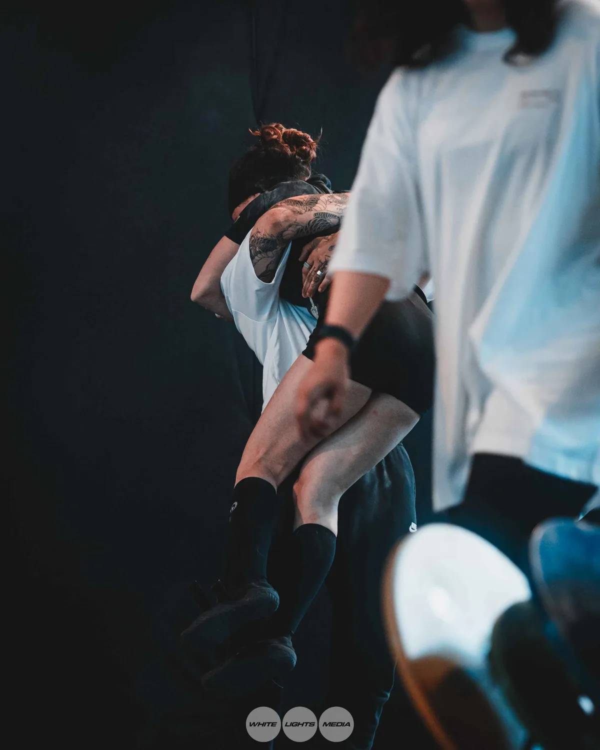 Hug between Atlas Coaching athletes