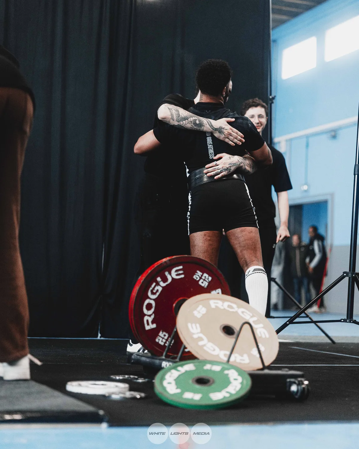 Hug between Atlas Coaching athletes