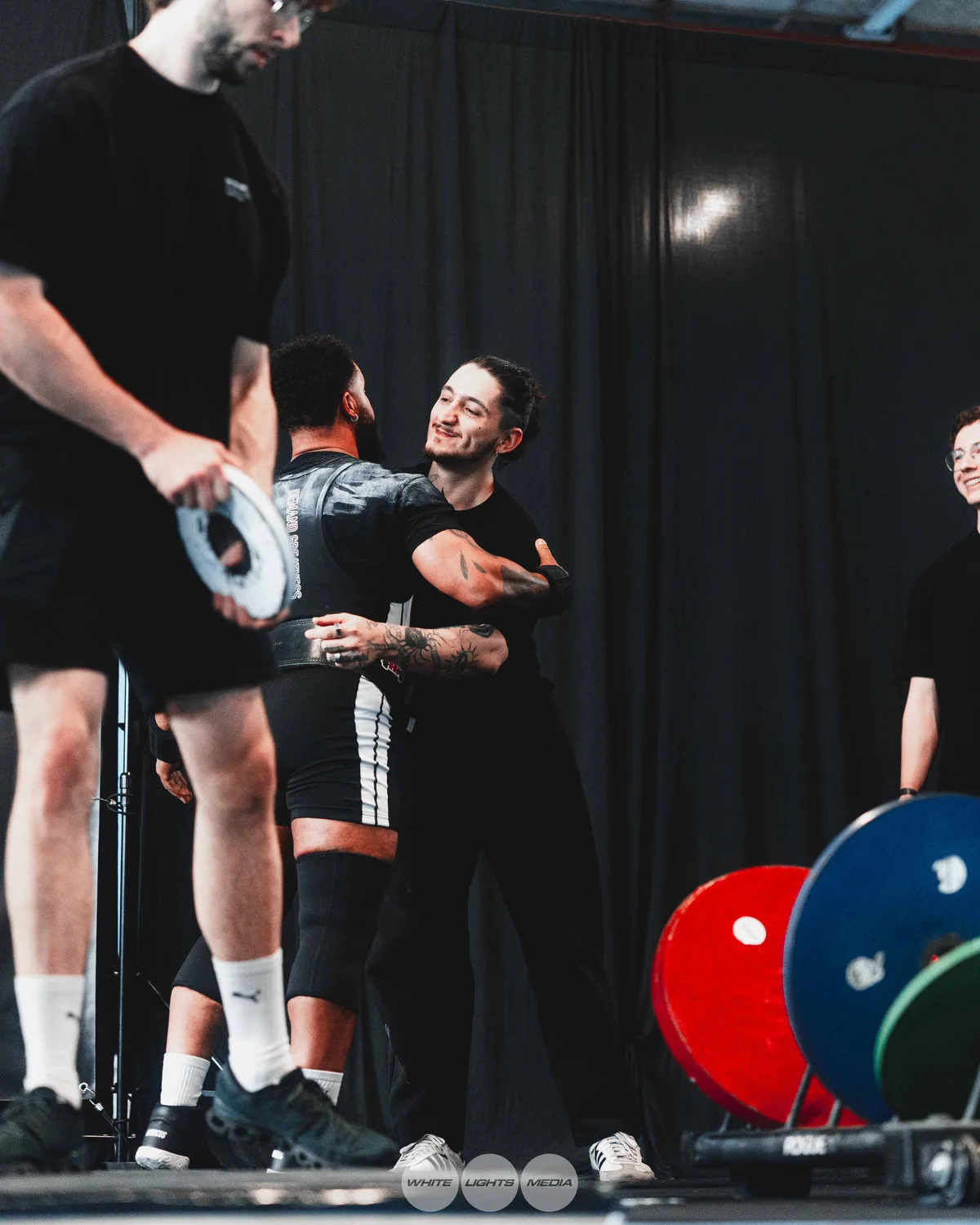 Hug between Atlas Coaching athletes