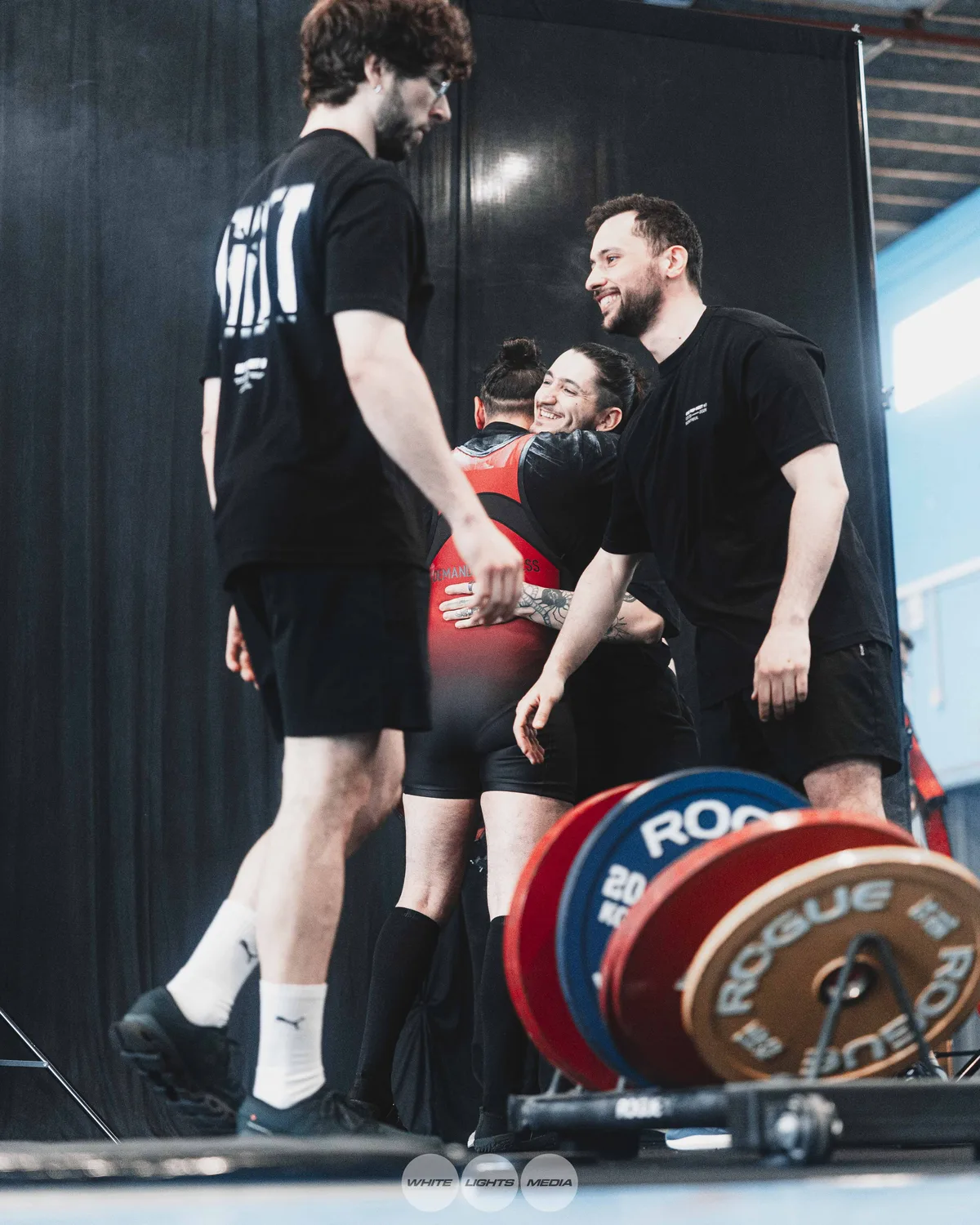 Hug between Atlas Coaching athletes