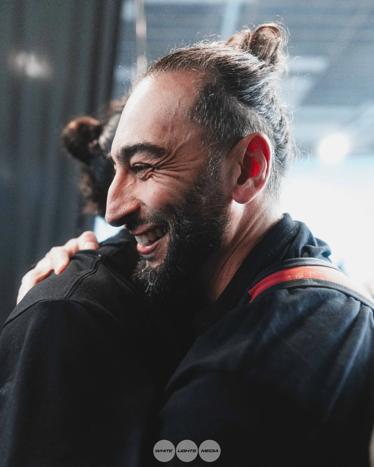 Hug between Atlas Coaching athletes