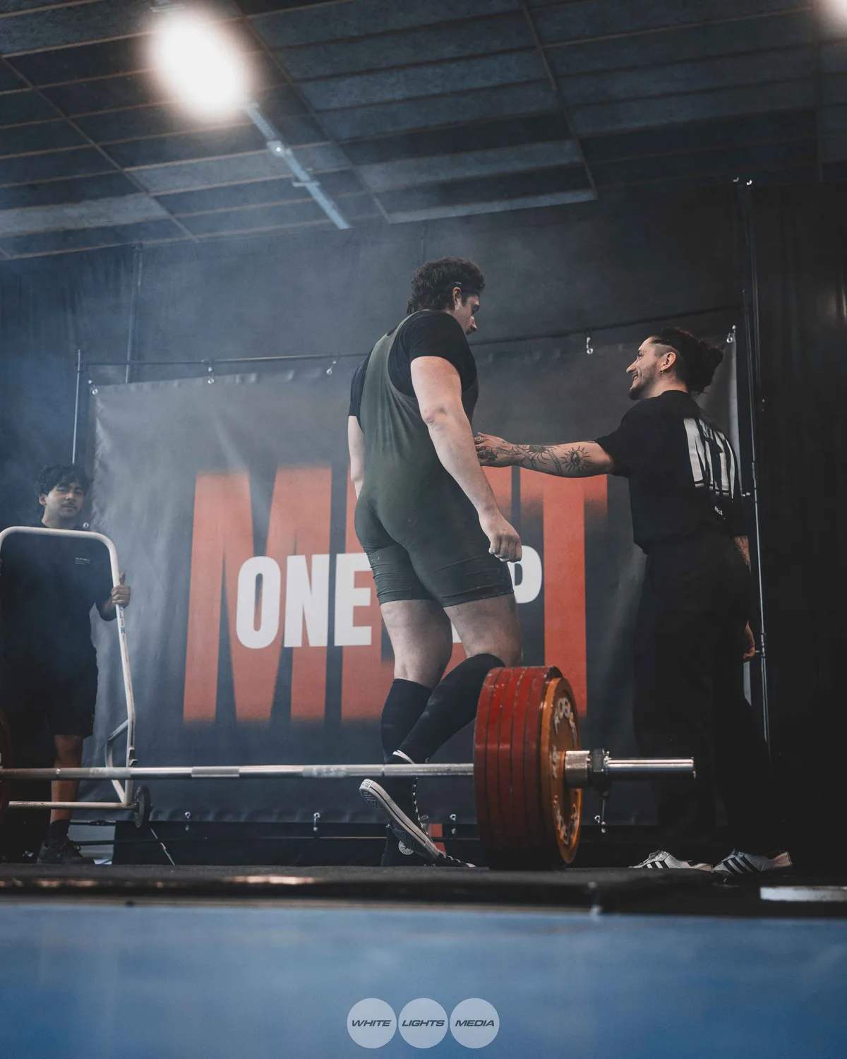 Hug between Atlas Coaching athletes