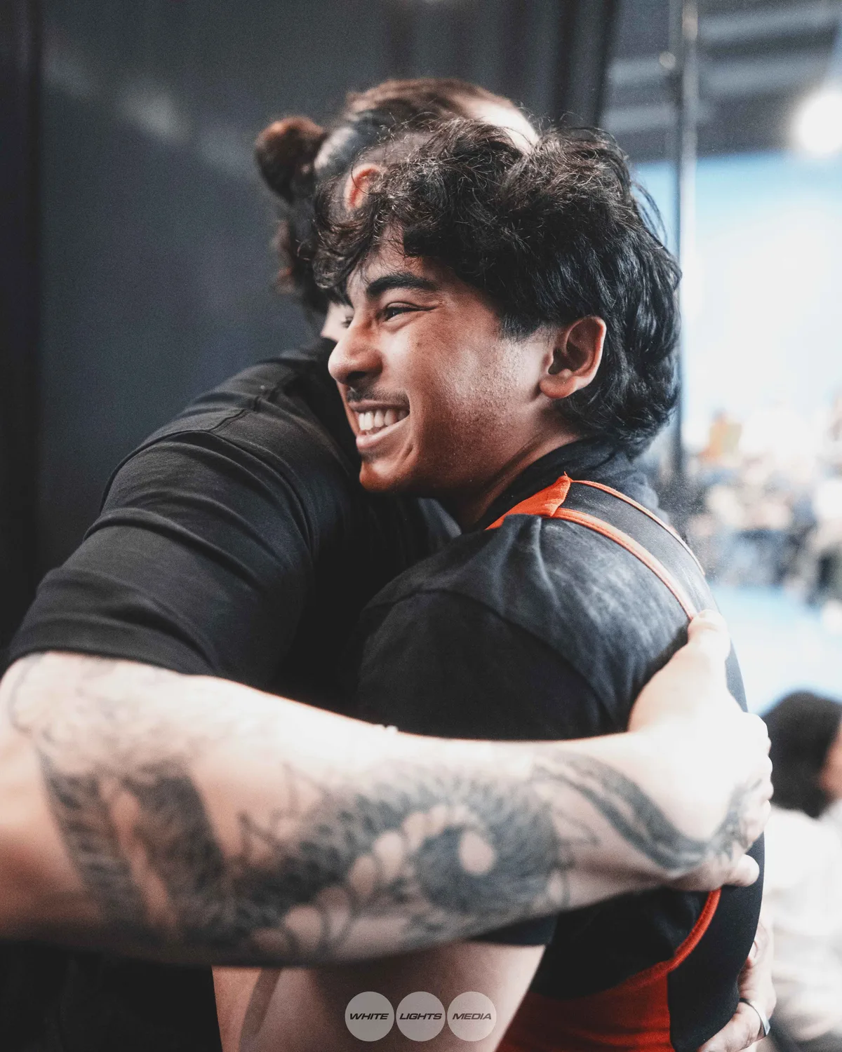 Hug between Atlas Coaching athletes